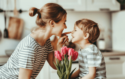 woman with son and flowers